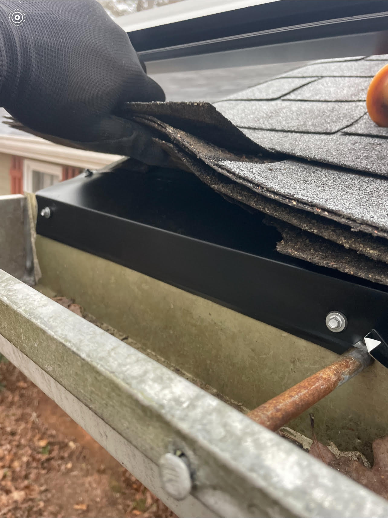 Metal used to seal roof gap to keep squirrels out of attic