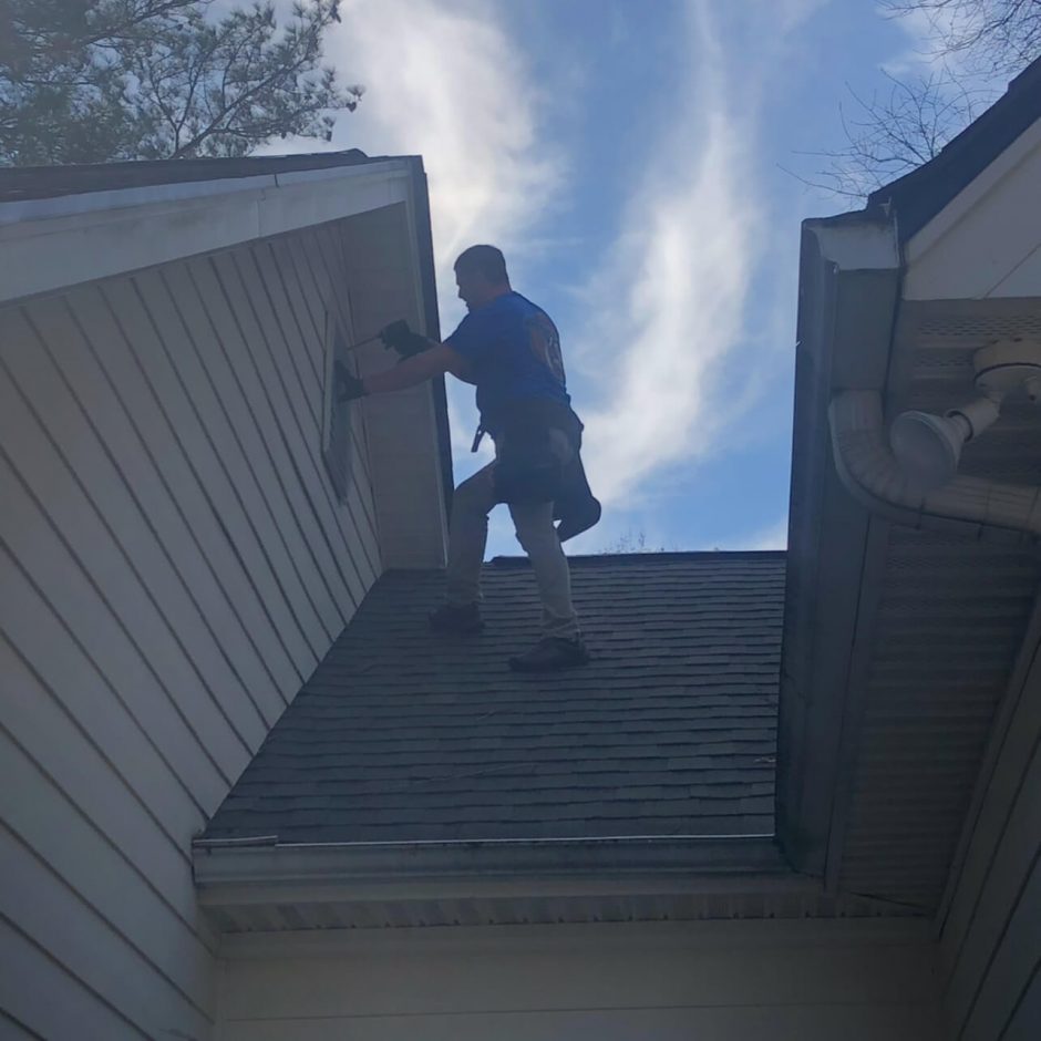 Chad on roof in Alpharetta sealing against bats